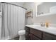Simple bathroom with dark vanity and neutral color scheme at 514 Perdue Trl, Canton, GA 30115
