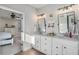 Bathroom boasts double sinks with large mirrors, modern lighting, and neutral decor at 514 Perdue Trl, Canton, GA 30115