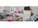 Inviting bonus room featuring cozy seating, entertainment area, and playful décor at 514 Perdue Trl, Canton, GA 30115