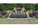 Beautiful entrance to Governor's Preserve with water feature, landscaping, and stone signage at 514 Perdue Trl, Canton, GA 30115