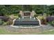 Governor's Preserve entrance featuring a water feature, flowers, and manicured landscaping at 514 Perdue Trl, Canton, GA 30115