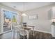 Cozy dining area with sliding glass doors to deck, neutral decor, and abundant natural light at 514 Perdue Trl, Canton, GA 30115