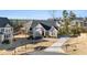 House exterior showcasing a brick facade, landscaping, and a driveway at 514 Perdue Trl, Canton, GA 30115