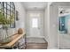 Bright foyer features wood floors, decor and a view into an adjacent room at 514 Perdue Trl, Canton, GA 30115