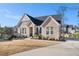 Beautiful brick home with mature landscaping, a welcoming entrance, long drive and lovely curb appeal at 514 Perdue Trl, Canton, GA 30115