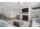 Comfortable living area with a fireplace, neutral decor, and seamless flow into the kitchen and dining areas at 514 Perdue Trl, Canton, GA 30115
