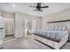Spacious main bedroom boasts a decorative ceiling fan, ensuite bathroom, and neutral decor at 514 Perdue Trl, Canton, GA 30115