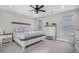 Charming main bedroom with two large windows for natural light, a ceiling fan, and neutral décor at 514 Perdue Trl, Canton, GA 30115
