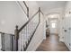 Entryway features a staircase with white risers and a dark wood banister, leading to the upper level at 514 Perdue Trl, Canton, GA 30115