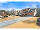 Two-story house with a long driveway and mature trees at 1251 Irwin Lake Way, Marietta, GA 30064