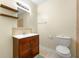 Basement bathroom with a toilet and wood vanity at 1251 Irwin Lake Way, Marietta, GA 30064