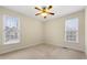 Bright bedroom with two large windows and ceiling fan at 1251 Irwin Lake Way, Marietta, GA 30064