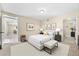 Bright staged bedroom featuring a white bed frame and plenty of room at 1251 Irwin Lake Way, Marietta, GA 30064