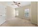 Spacious bedroom with ceiling fan and neutral carpeting at 1251 Irwin Lake Way, Marietta, GA 30064