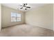 Well-lit bedroom featuring neutral walls and carpet at 1251 Irwin Lake Way, Marietta, GA 30064