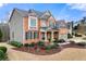 Side view of a two-story house with gray siding and brick accents at 1251 Irwin Lake Way, Marietta, GA 30064
