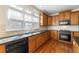 Bright kitchen with granite countertops and wooden cabinetry at 1251 Irwin Lake Way, Marietta, GA 30064
