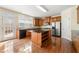 Modern kitchen with stainless steel appliances and hardwood floors at 1251 Irwin Lake Way, Marietta, GA 30064