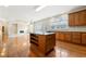 Kitchen features island, hardwood floors, and stainless steel appliances at 1251 Irwin Lake Way, Marietta, GA 30064