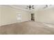 Large main bedroom with carpeted floors and ceiling fan at 1251 Irwin Lake Way, Marietta, GA 30064