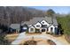 Luxury home on wooded lot with circular driveway and detached garage at 5152 Boulder Bluff Way, Suwanee, GA 30024