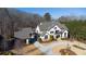 Luxury home on wooded lot with circular driveway and detached garage at 5152 Boulder Bluff Way, Suwanee, GA 30024