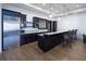 Basement bar with dark cabinetry, granite countertop, and stainless steel appliances at 5152 Boulder Bluff Way, Suwanee, GA 30024