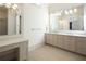 Spa-like bathroom with double vanity, large mirror, and beige cabinets at 5152 Boulder Bluff Way, Suwanee, GA 30024