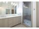 Bathroom with double vanity, large shower, and gray tile at 5152 Boulder Bluff Way, Suwanee, GA 30024