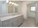 Bathroom with single vanity, quartz countertop, and gray cabinets at 5152 Boulder Bluff Way, Suwanee, GA 30024