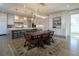 Spacious dining area features a large wooden table and an ornate rug at 5152 Boulder Bluff Way, Suwanee, GA 30024