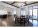 Round dining table with chairs and access to the game room at 5152 Boulder Bluff Way, Suwanee, GA 30024