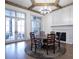 Bright dining room with hardwood floors, a round table, and fireplace at 5152 Boulder Bluff Way, Suwanee, GA 30024