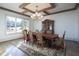 Formal dining room featuring hardwood floors, chandelier, and large windows at 5152 Boulder Bluff Way, Suwanee, GA 30024