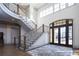 Grand foyer with sweeping staircase, hardwood floors and high ceilings at 5152 Boulder Bluff Way, Suwanee, GA 30024