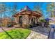 Stone guard house at community entrance at 5152 Boulder Bluff Way, Suwanee, GA 30024