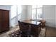 Bright home office with wood desk, leather chairs, and wood floors at 5152 Boulder Bluff Way, Suwanee, GA 30024