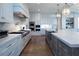 Large kitchen with island, white cabinets, and stainless steel appliances at 5152 Boulder Bluff Way, Suwanee, GA 30024