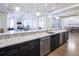 Large kitchen island with granite countertops and stainless steel appliances at 5152 Boulder Bluff Way, Suwanee, GA 30024