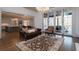 Spacious living area with view into kitchen and access to outdoor patio at 5152 Boulder Bluff Way, Suwanee, GA 30024