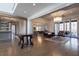 Open living room with hardwood floors and view into kitchen at 5152 Boulder Bluff Way, Suwanee, GA 30024