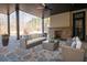 Relaxing covered patio with fireplace and comfortable seating area at 5152 Boulder Bluff Way, Suwanee, GA 30024