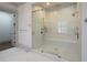 Large walk-in shower with glass enclosure and built-in seat at 5152 Boulder Bluff Way, Suwanee, GA 30024