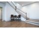 Elegant staircase with hardwood floors and white railings at 5152 Boulder Bluff Way, Suwanee, GA 30024
