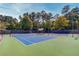 Two well-maintained tennis courts at 5152 Boulder Bluff Way, Suwanee, GA 30024