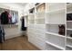 Spacious walk-in closet with ample shelving and hanging space at 5152 Boulder Bluff Way, Suwanee, GA 30024