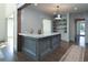Custom wet bar with marble countertop and gray wood cabinetry at 5152 Boulder Bluff Way, Suwanee, GA 30024