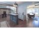 Basement wet bar with view into formal dining room at 5152 Boulder Bluff Way, Suwanee, GA 30024
