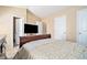 Bedroom with a TV, and two closets, one to the left showing a toilet through its doorway at 4211 Wingfoot Ct, Decatur, GA 30035