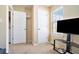 Cozy bedroom with a TV, window, and ample storage with two doors at 4211 Wingfoot Ct, Decatur, GA 30035